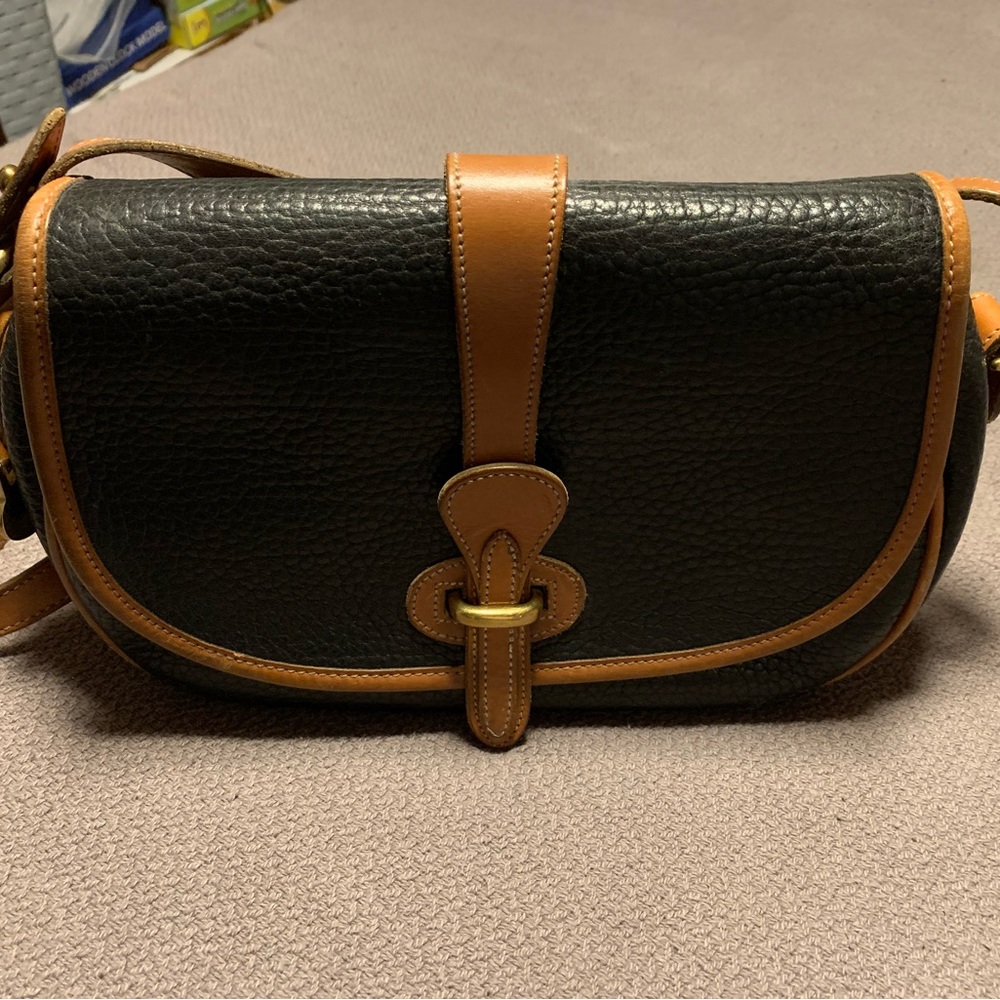 Dooney and Bourke black all weather leather crossbody/shoulder bag.